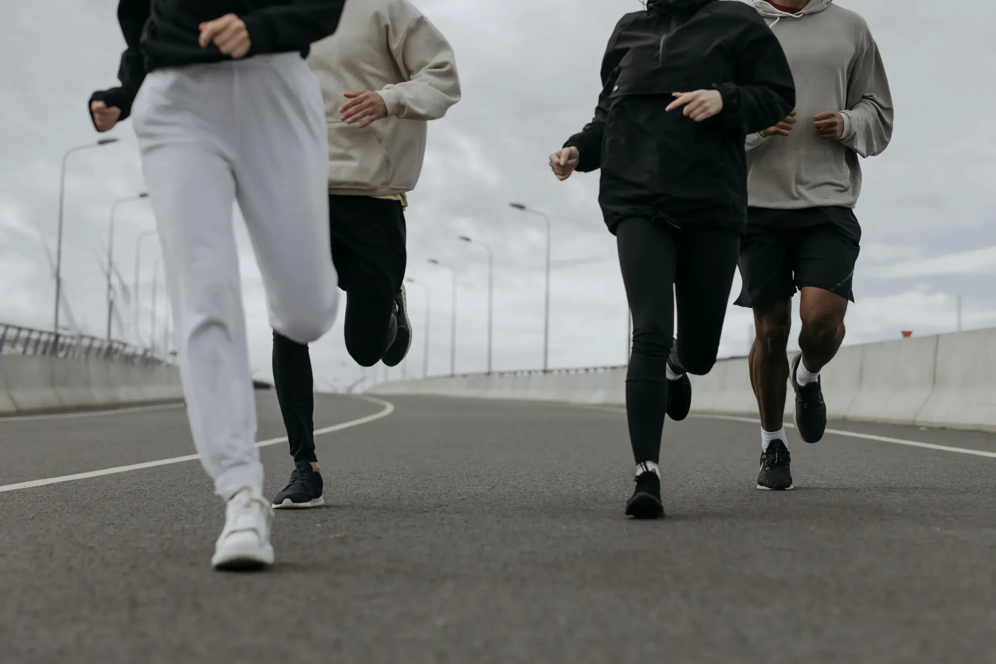 People jugging together on a road